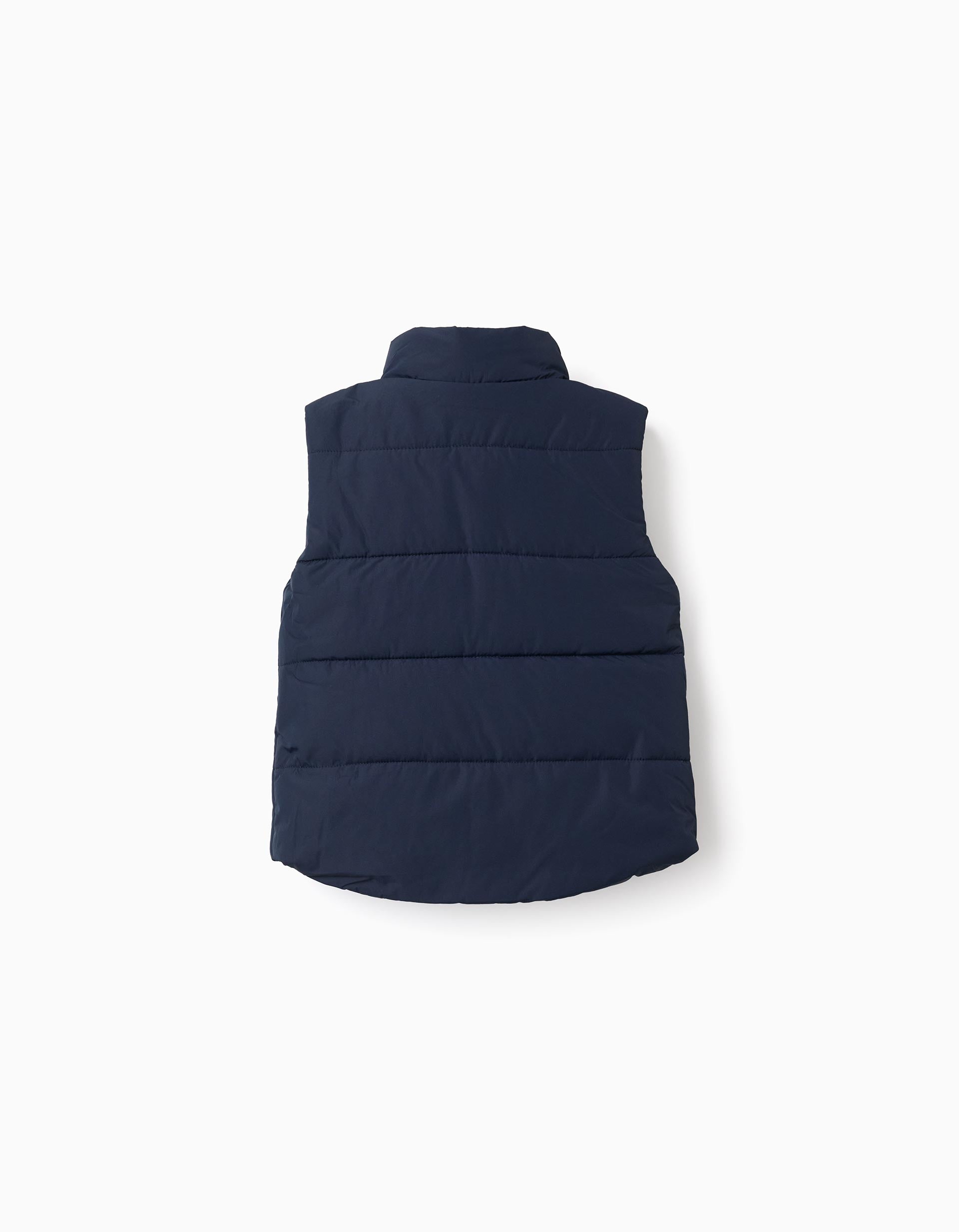 Padded vest with fleece lining and side pockets for babies, navy blue