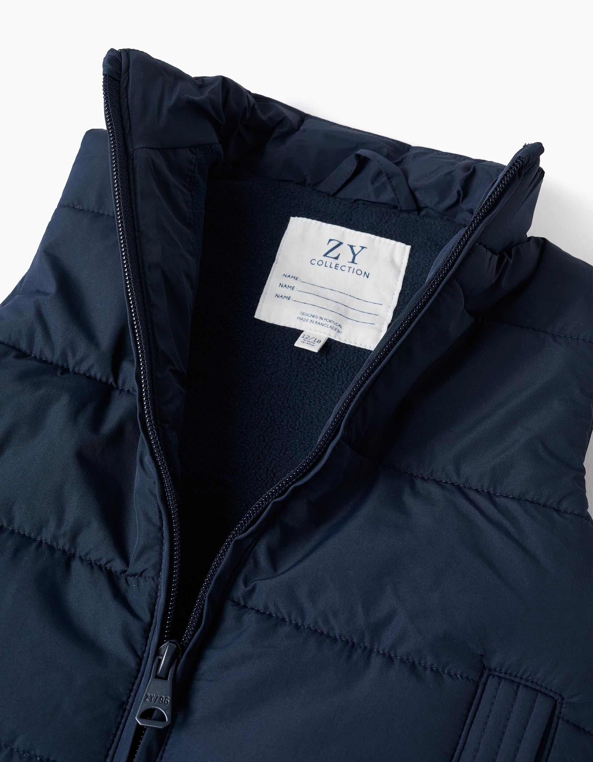 Padded vest with fleece lining and side pockets for babies, navy blue